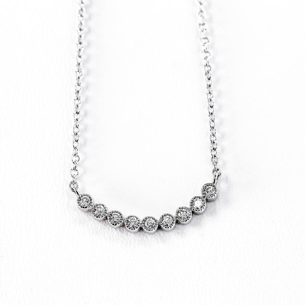 14K White Gold Curved Pendant with 0.14 total weight Round Diamonds