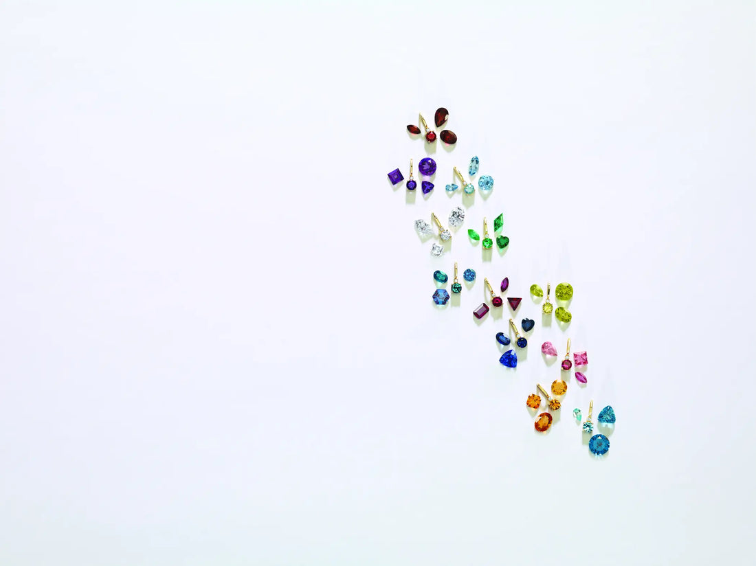 scattered colored gemstones against a white background