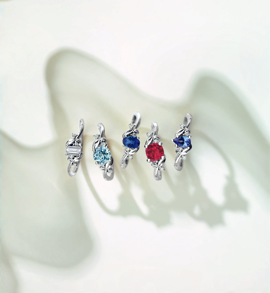 red white and blue gemstones mounted on rings