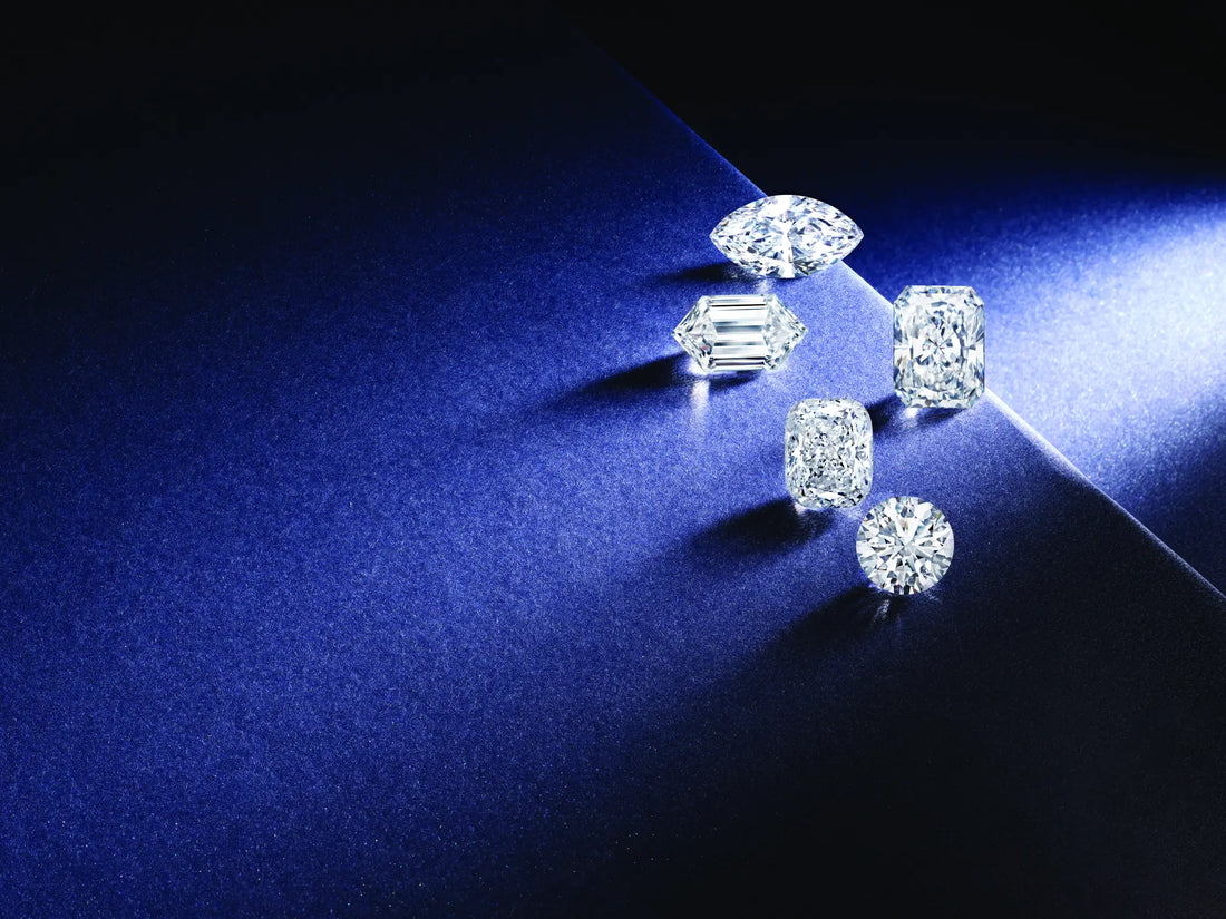 Muli shape diamonds against a navy blue background with sunlight steaming in from the top right corner