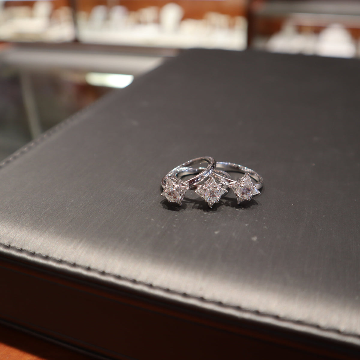 three custom designed diamond rings