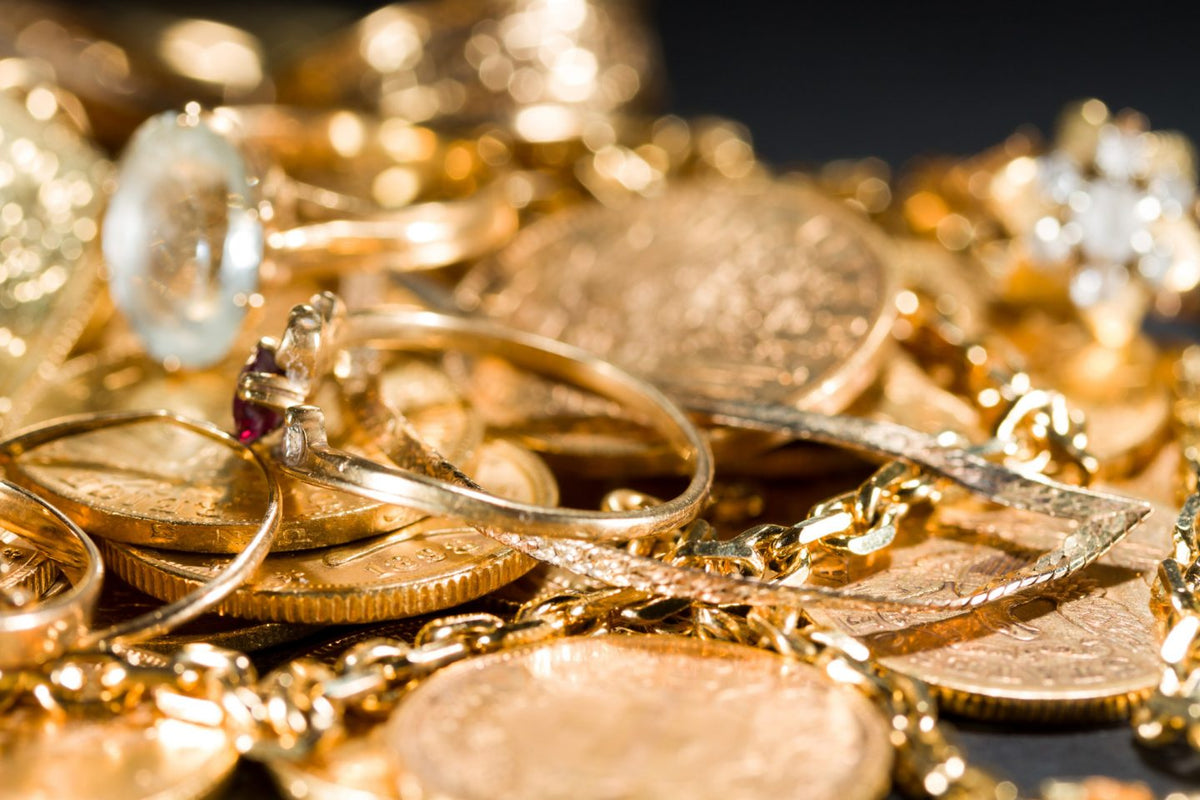 pile of gold chains and coins