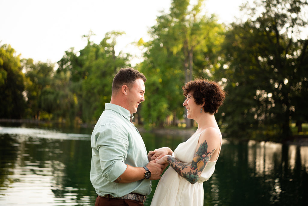 engaged couple smiling at each other