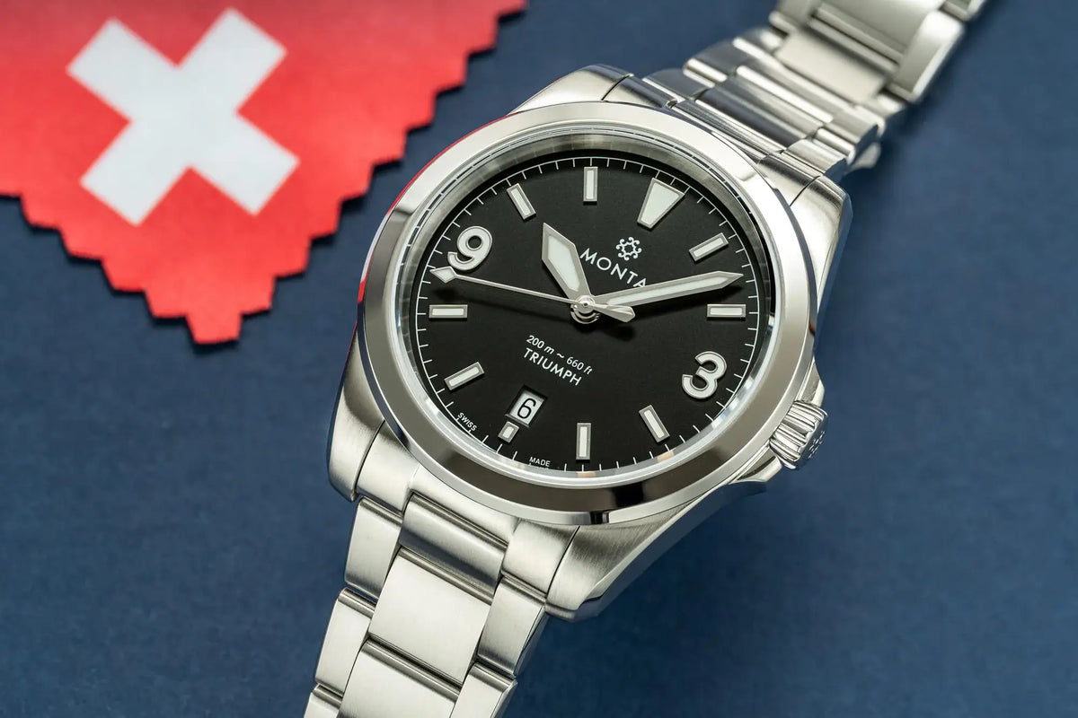 MONTA Black Dial Triumph Watch against blue background with Swedish flag