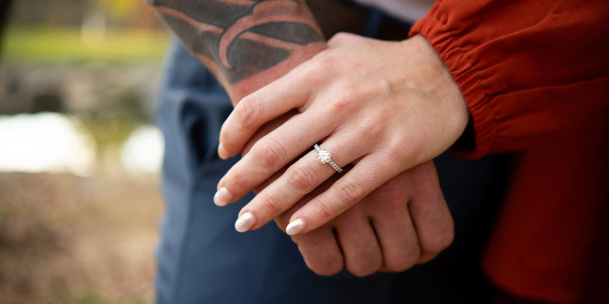a couple holding hands to show off an engagement ring Lancaster PA