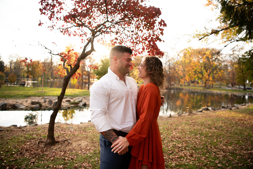 engaged couple with fall leaves