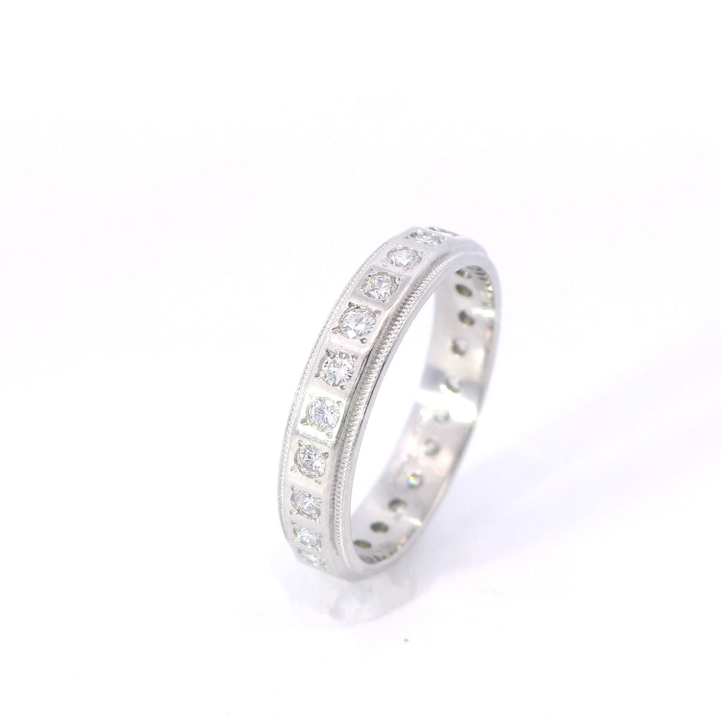 Estate Platinum Beveled Edge Flush Diamond Eternity Band