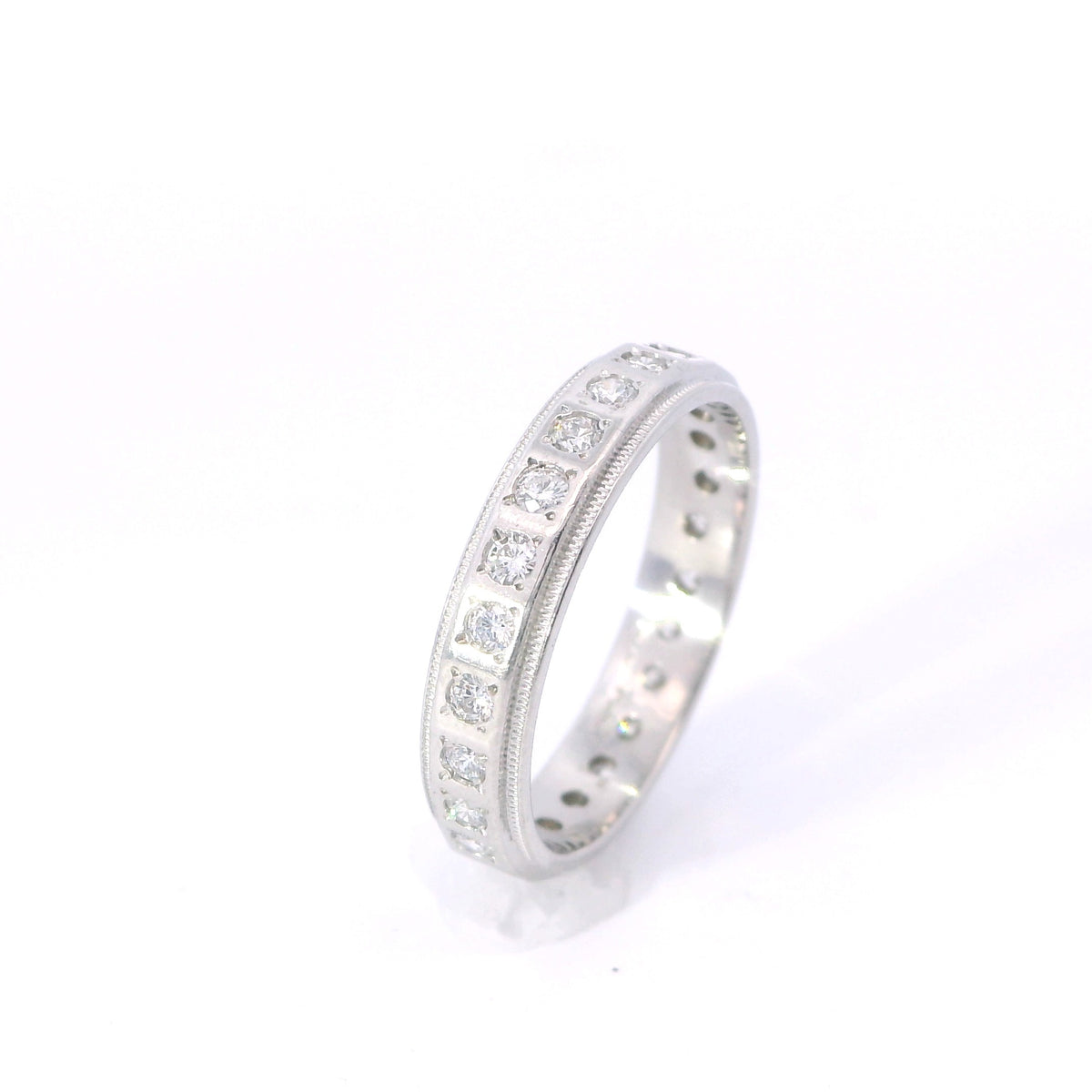 Estate Platinum Beveled Edge Flush Diamond Eternity Band