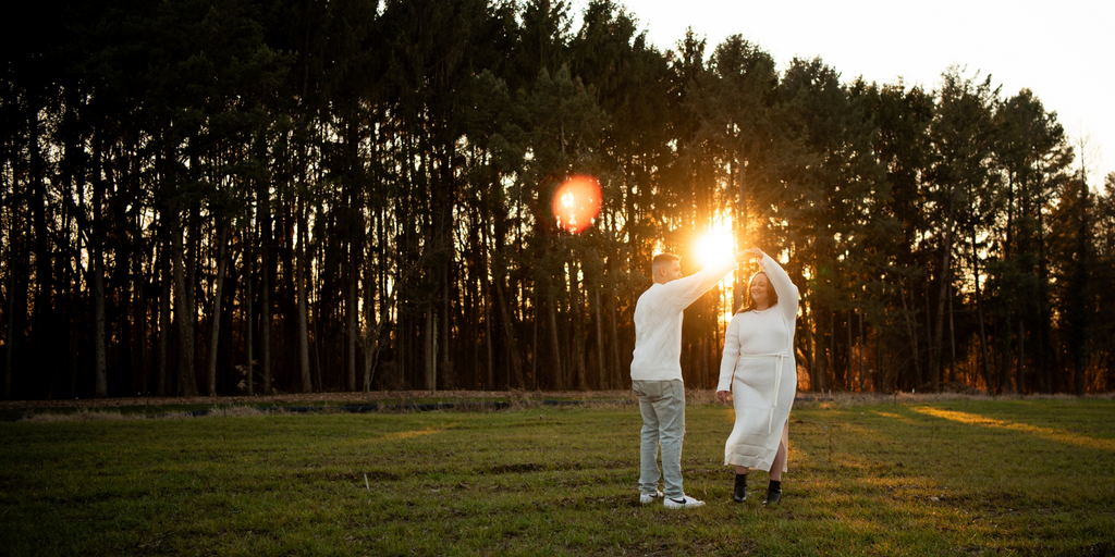 Couple Dancing At Sunset Outdoors