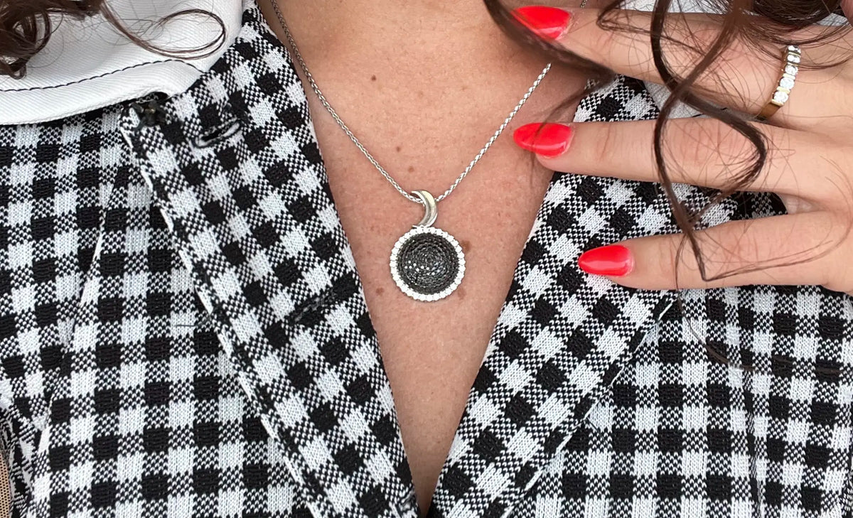 Woman wearing eclipse pendent