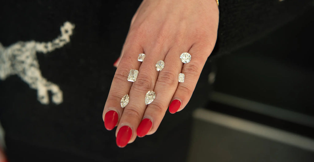 Loose Diamonds on woman's hand