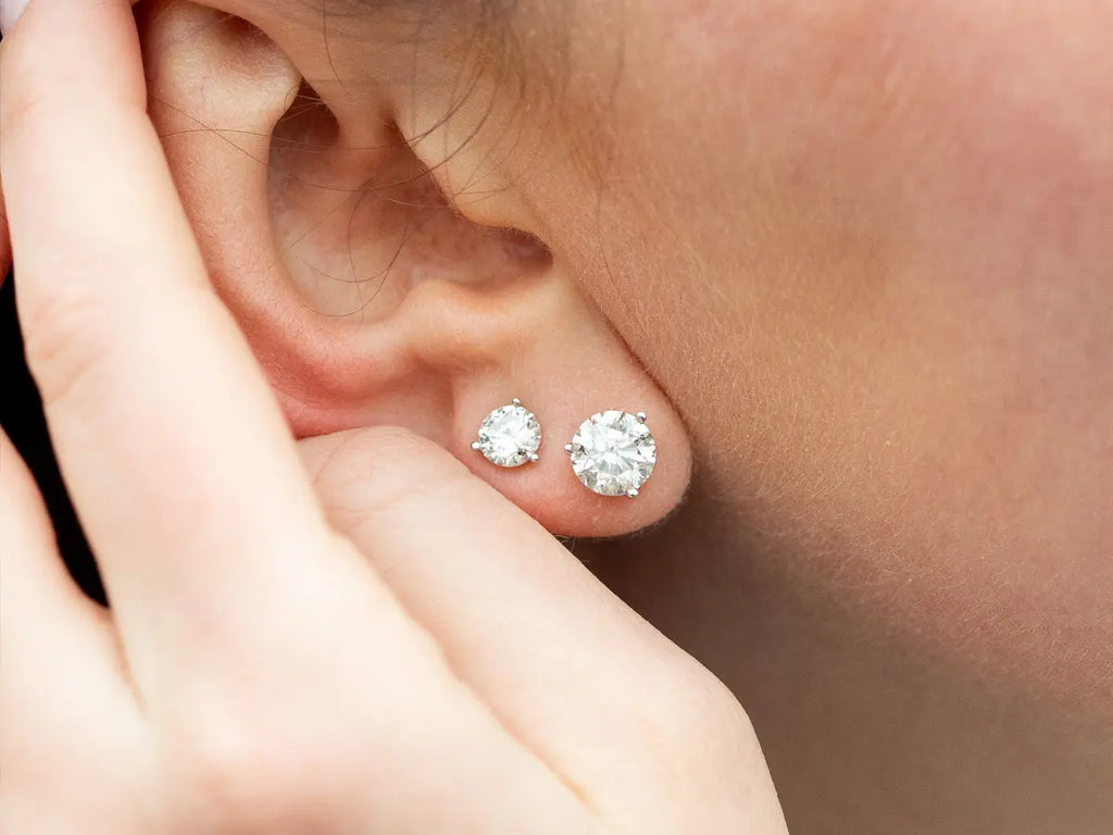 Photo Of Woman's Ear Wearing Diamond Earrings