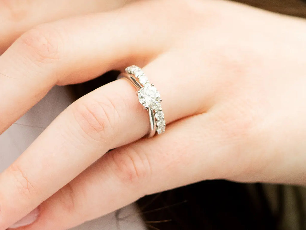 Diamond engagement ring on woman's ring finger