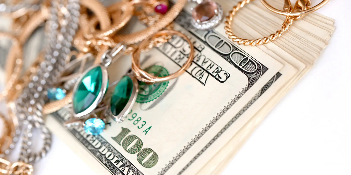 Jewelry and cash on white background