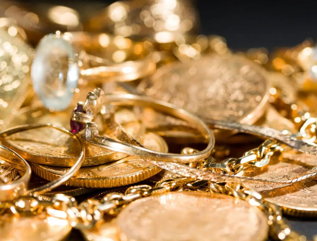 gold jewelry and gold coins