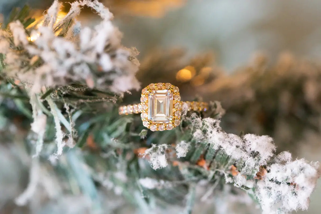 Diamond ring on pine tree covered in snow