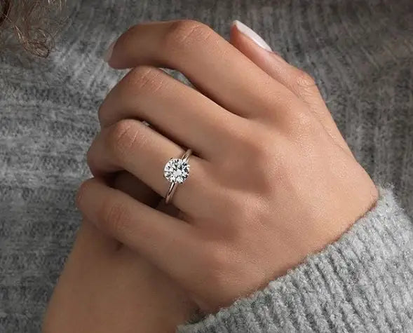Diamond engagement ring on hand